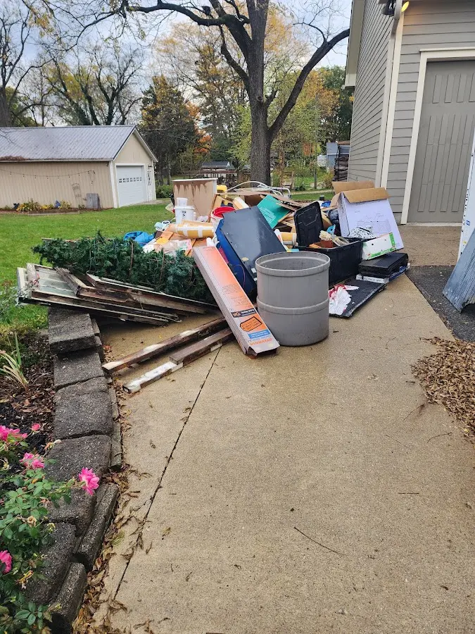 Dumpster being loaded with debris for Residential Dumpster Rental in Park Center